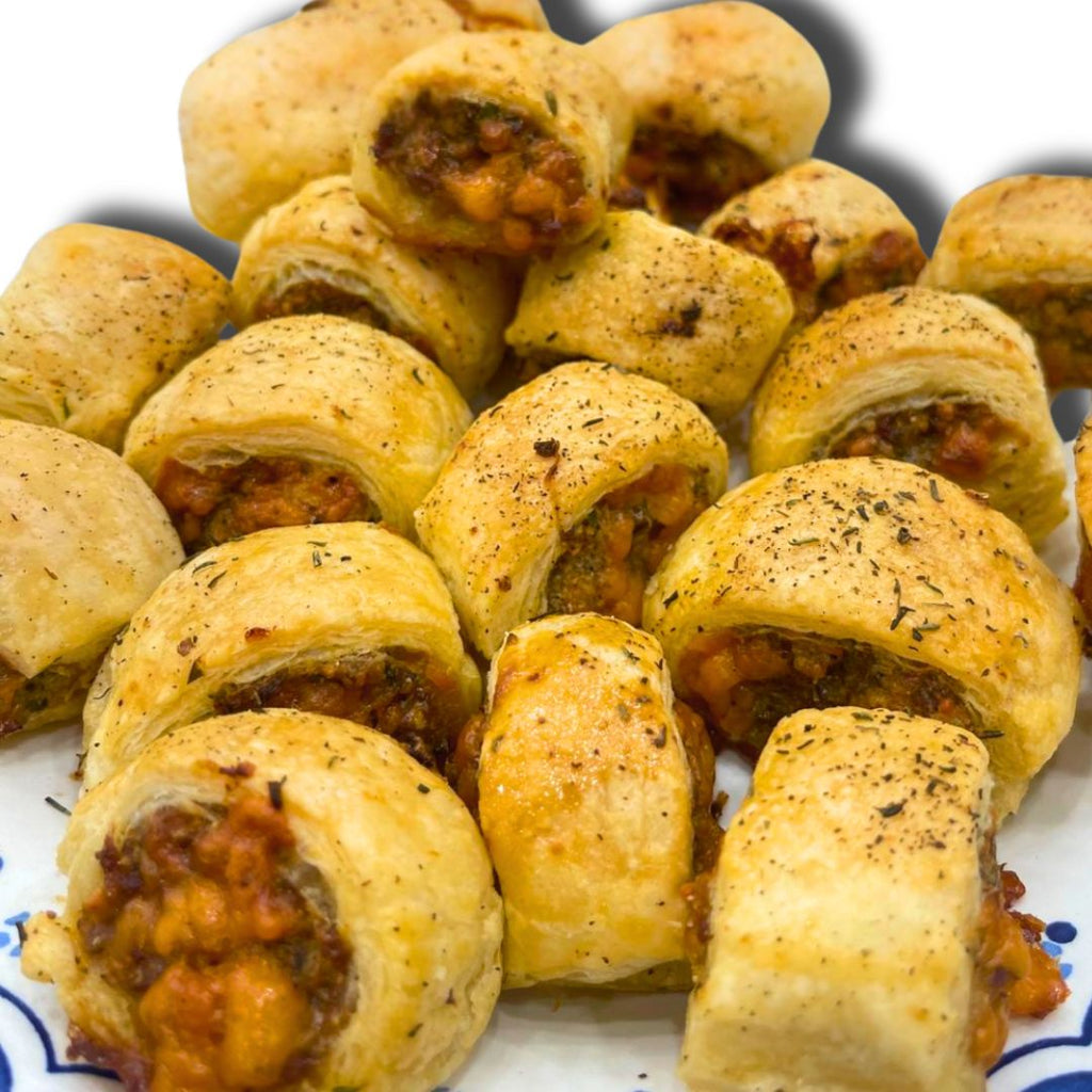 Golden flaky puff pastry cheese sausage rolls, perfectly baked and ready to serve as appetizers.