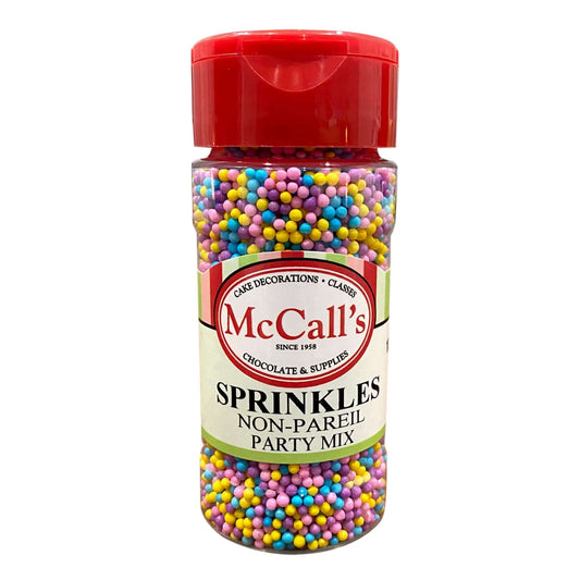McCall's non-pareil party mix sprinkles in a clear container, colorful and perfect for cake decorating.
