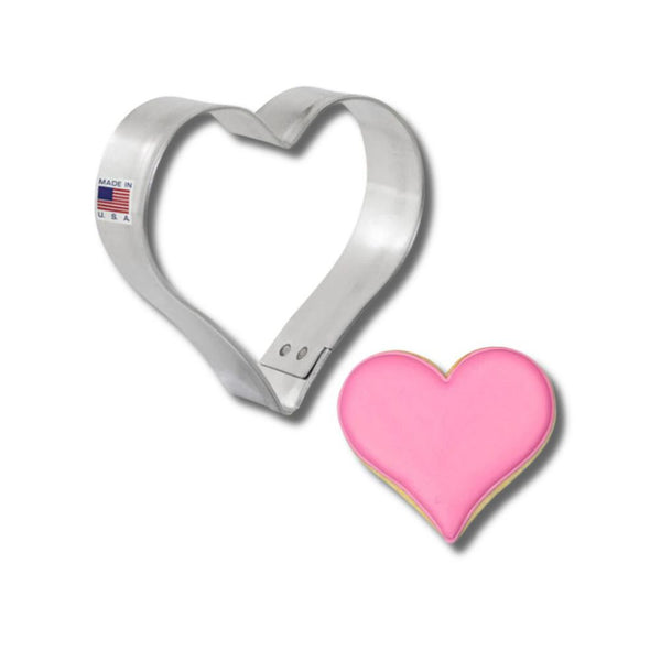 Ann Clark heart cookie cutter with a pink heart cookie, perfect for Valentine's Day baking.