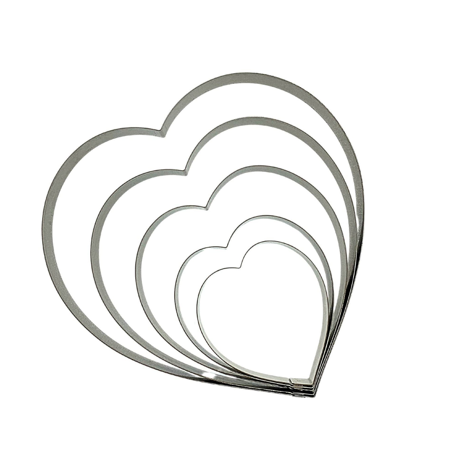 Set of stainless steel heart-shaped cake rings, perfect for baking desserts, made in Canada.