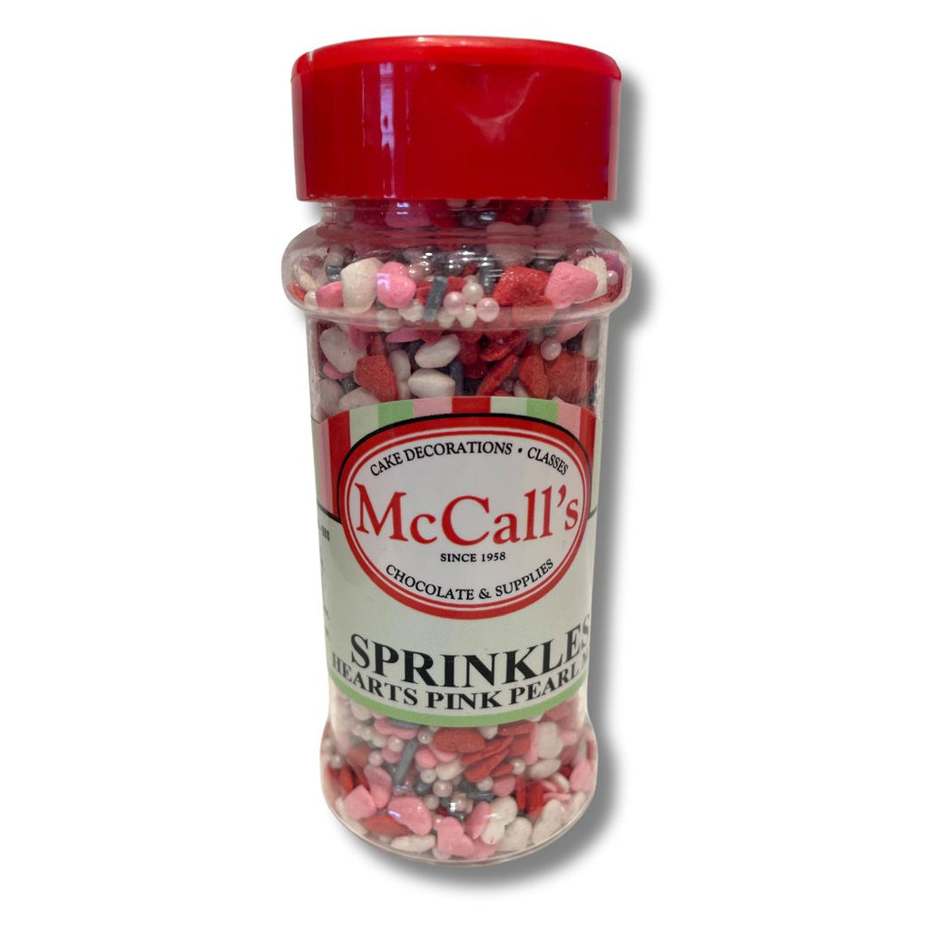 Sprinkles Hearts Pink Pearl Mix in a clear bottle with red lid, perfect for cake and dessert decoration.