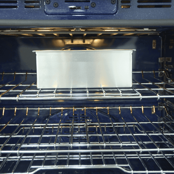  LOAF PAN (4 X 13 X 4 INCH) ,High-quality food-grade aluminum loaf pan inside of an oven ready to be baked Crown Cookware