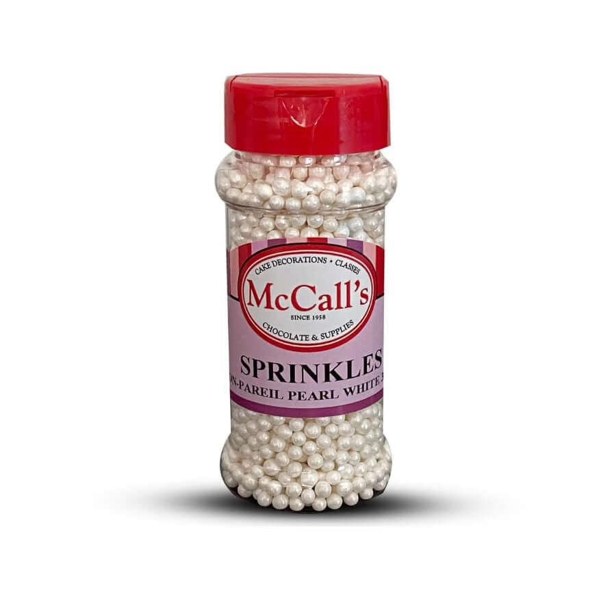 McCall's sprinkles pearl white nonpareil 100g container for decorating baked goods and desserts.