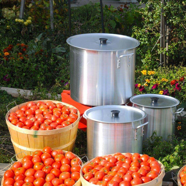 Low Stock Pot Braziers 35Q / 32L - Durable stainless steel with a low profile, perfect for even cooking and large quantities - Outside with large food quantity in front- Crown Cookware